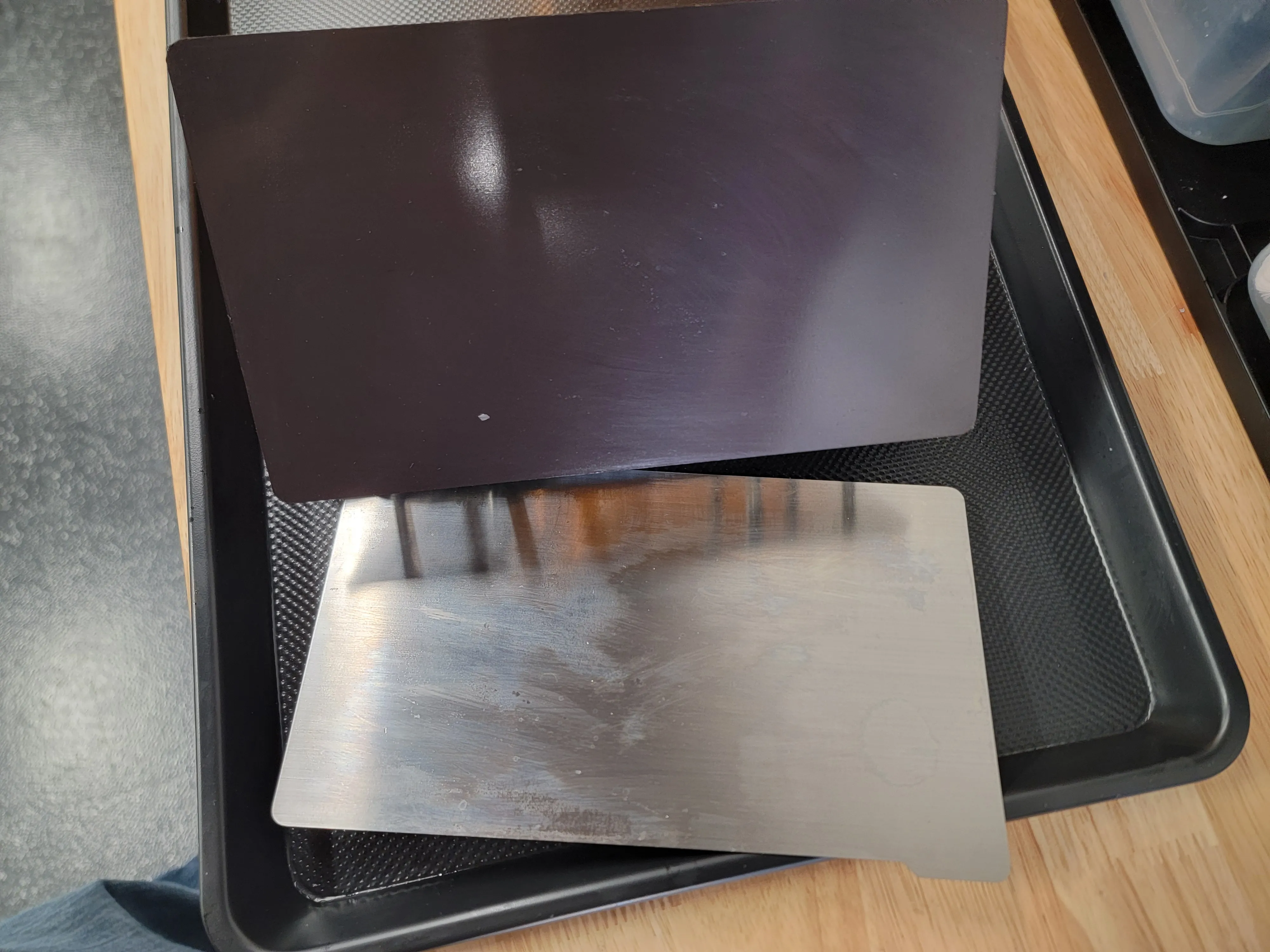 The build plate separated and laying down with magneti plate not attached